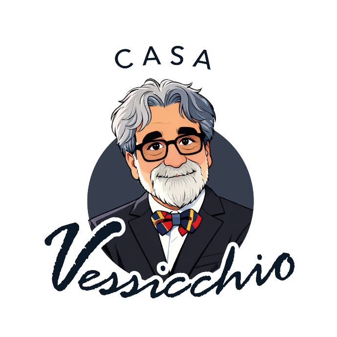 Illustrazione del logo “Casa Vessicchio” con ritratto stilizzato di uomo anziano con capelli e barba grigi, occhiali e papillon, su sfondo chiaro.